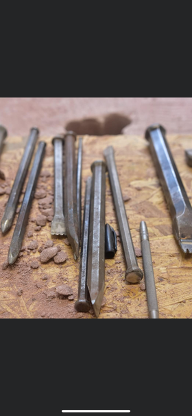 Traditional stonemason chisels ready for work