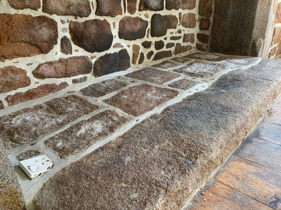 Granite hearth step and lime pointing