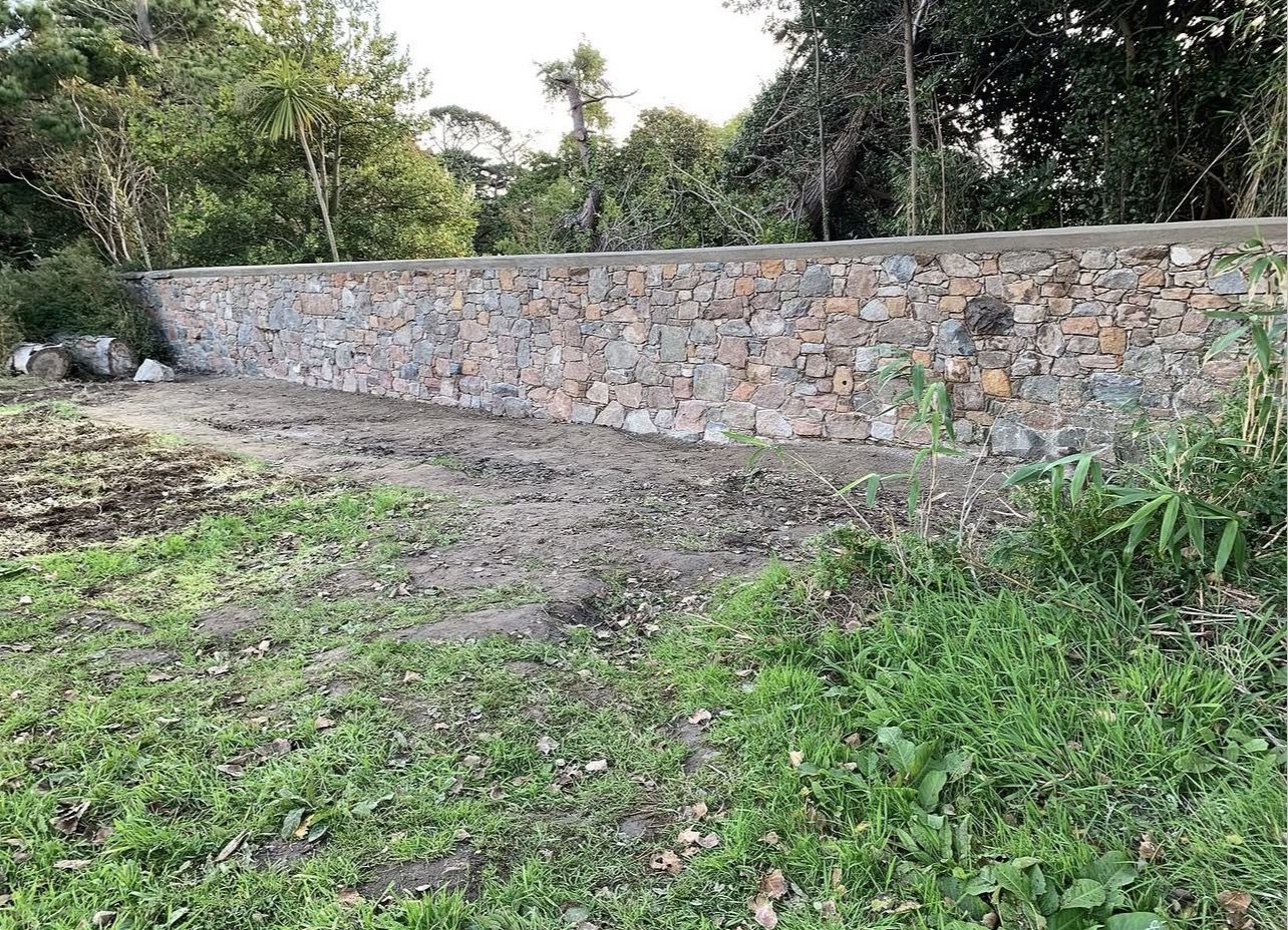 Retaining Wall Build, after: completed stonework in Jersey