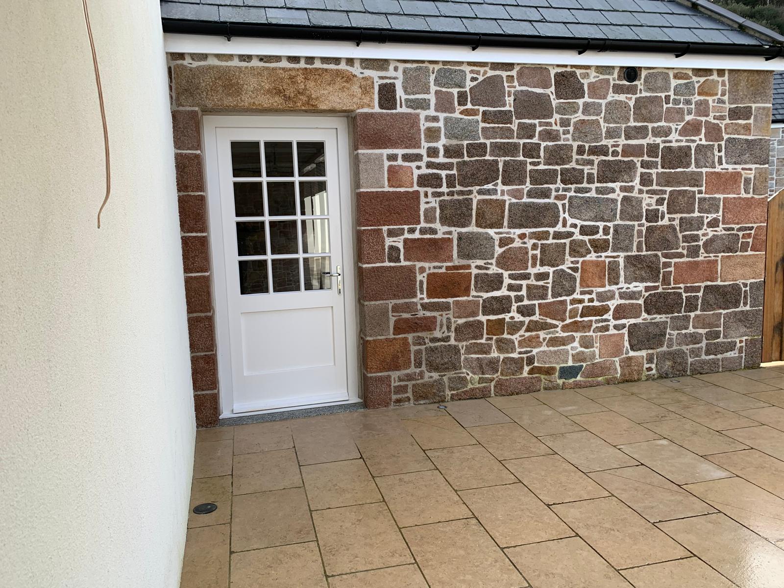 Granite Wall & Doorway, after: completed stonework in Jersey